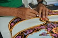 Malaysian kite maker working on a kite in his workshop Royalty Free Stock Photo